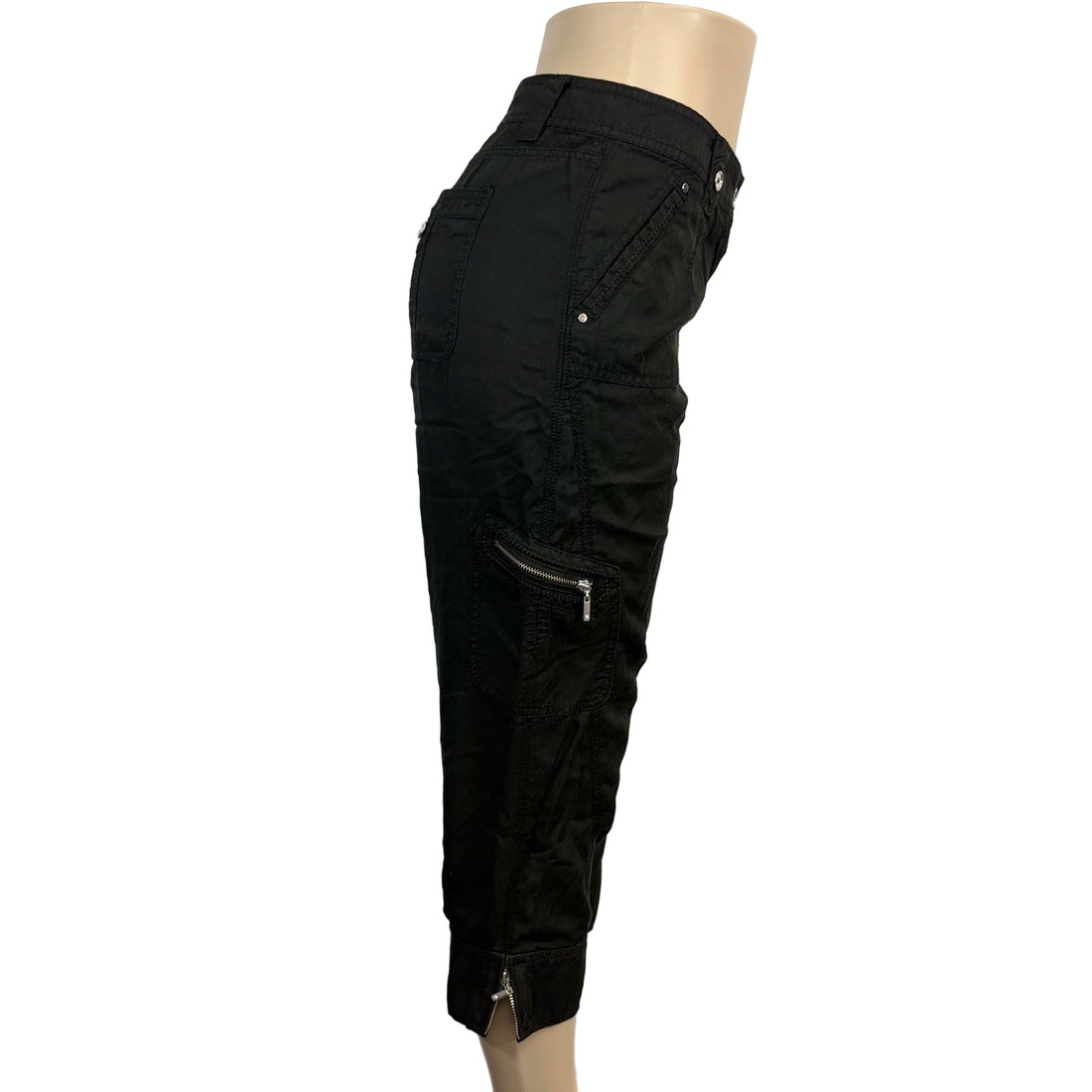 Black pants on a mannequin against a plain background