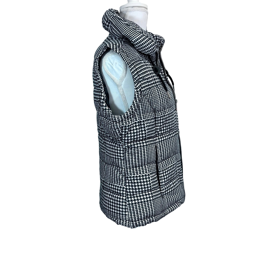 Houndstooth patterned vest on a mannequin against a white background