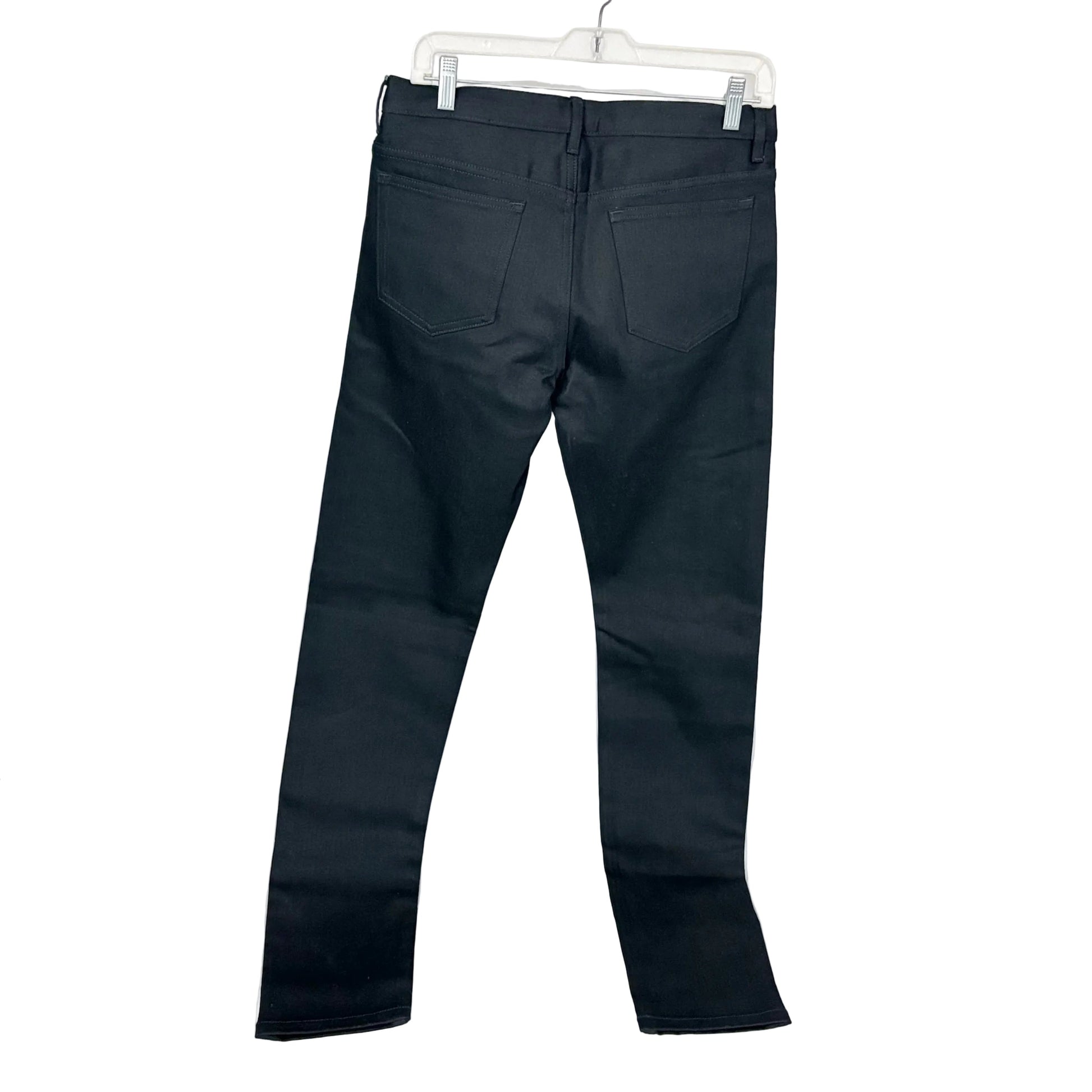 Black pants on a white hanger against a white background
