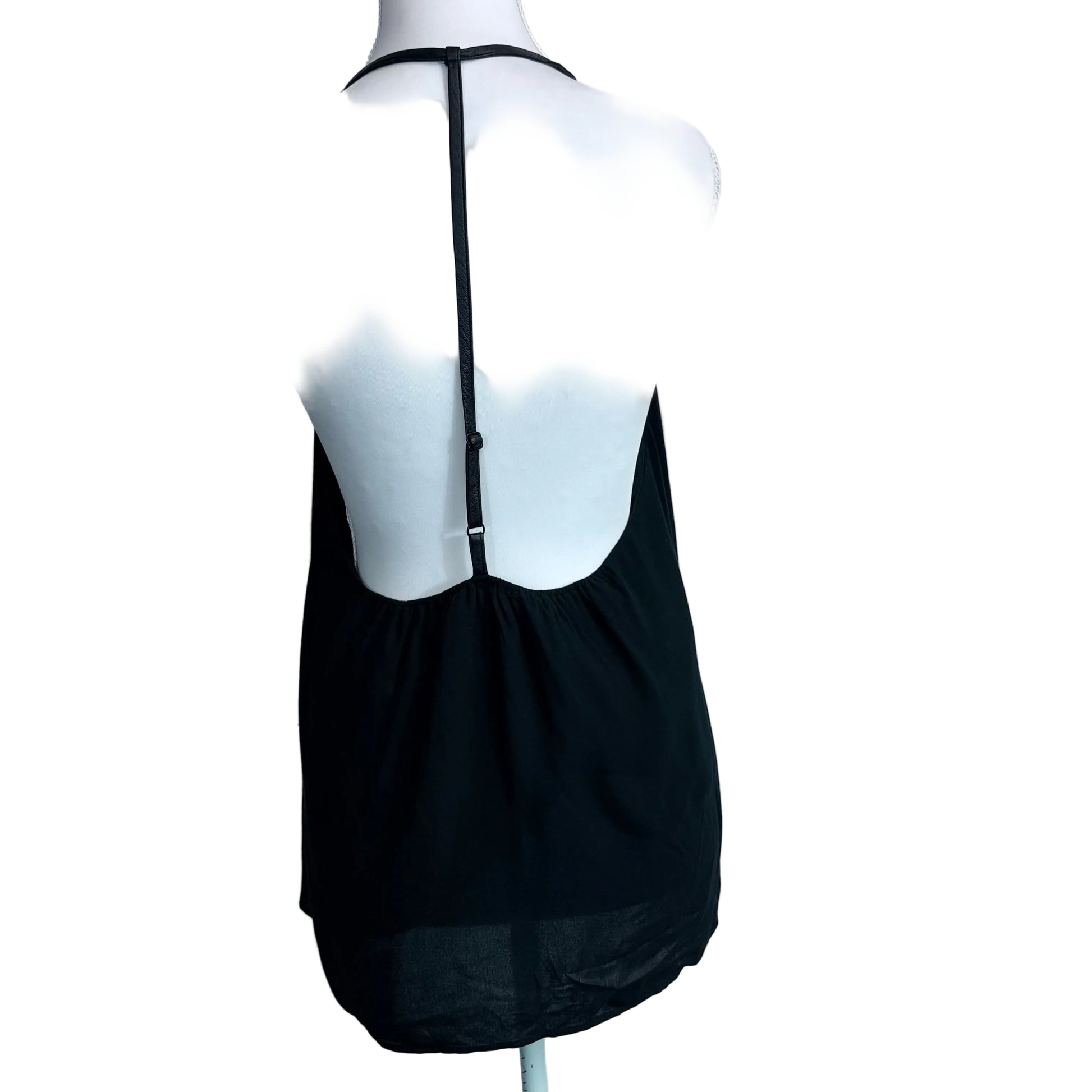 Black dress on a mannequin with a white background