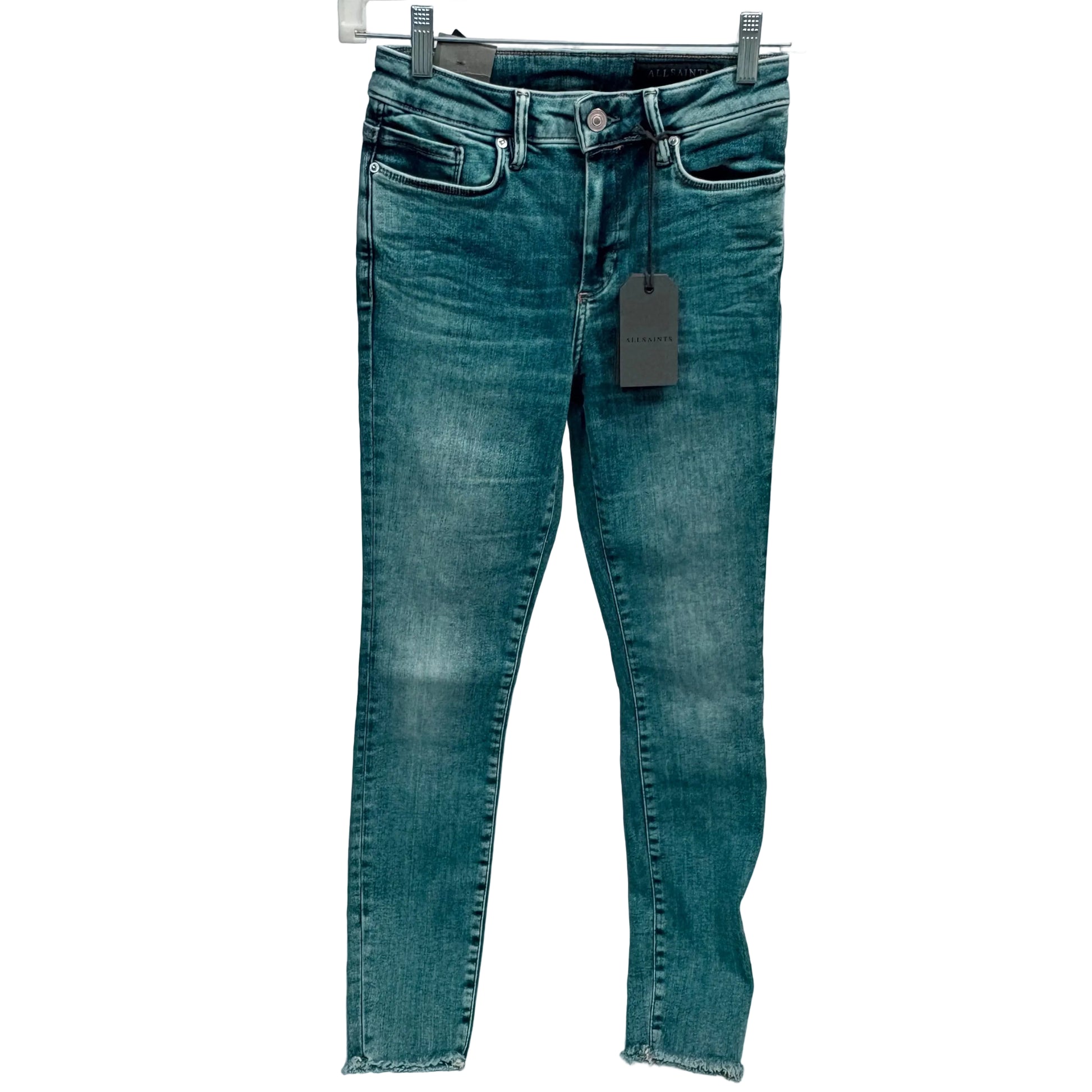 Blue jeans with a tag on a white background