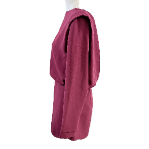 Pink dress on a mannequin against a white background
