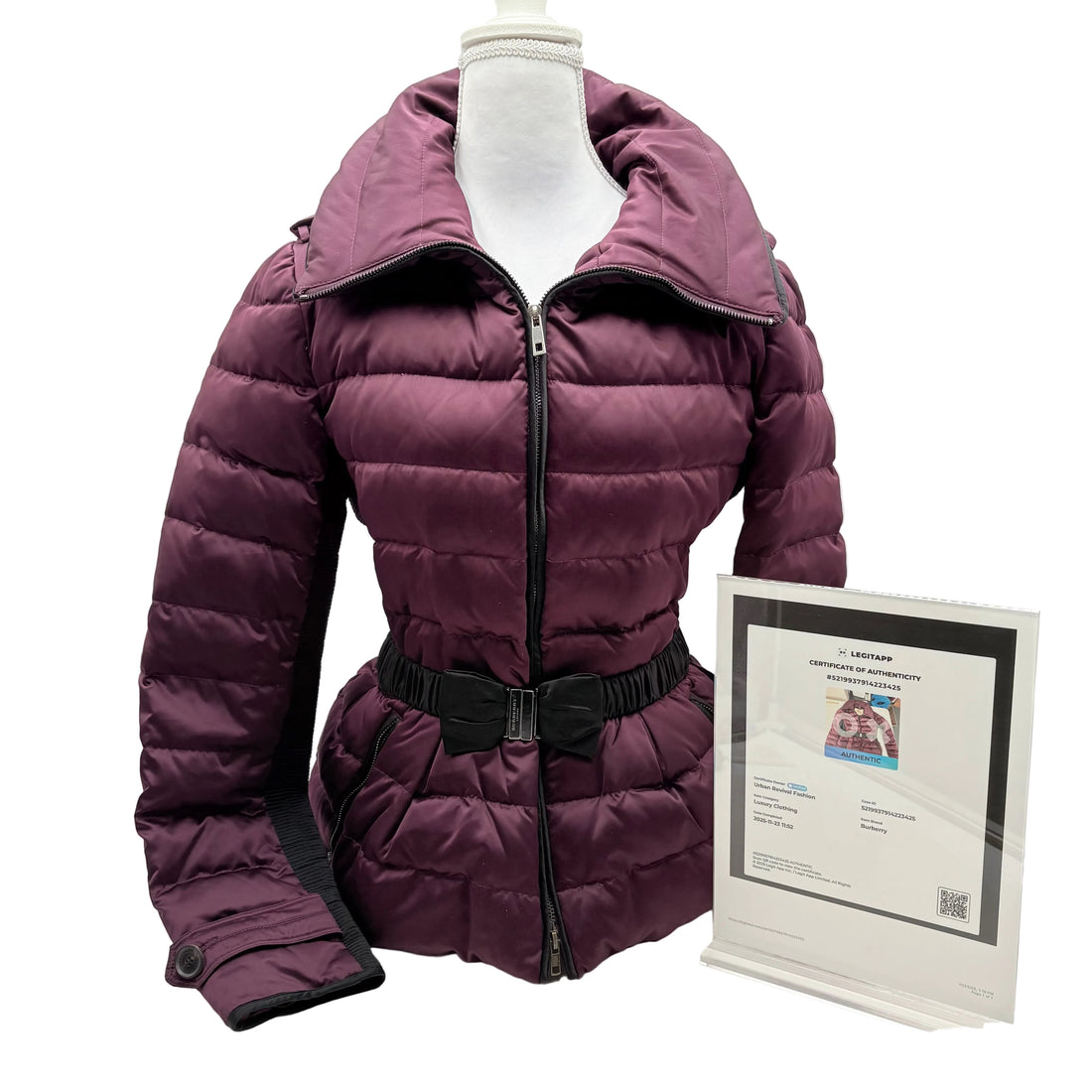 Purple puffer jacket on a mannequin with a certificate on a white background