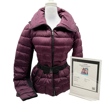 Purple puffer jacket on a mannequin with a certificate on a white background
