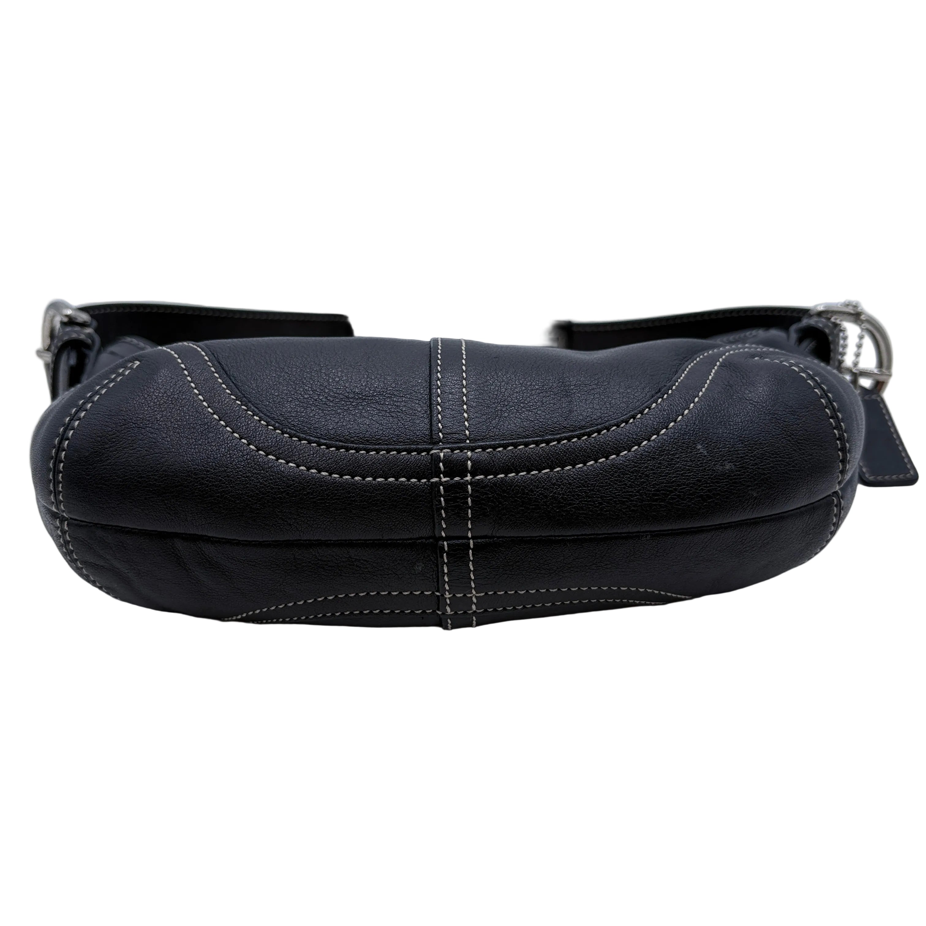 Black leather bag on a white background