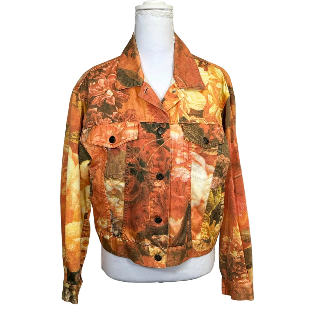 Floral patterned jacket on a mannequin against a white background