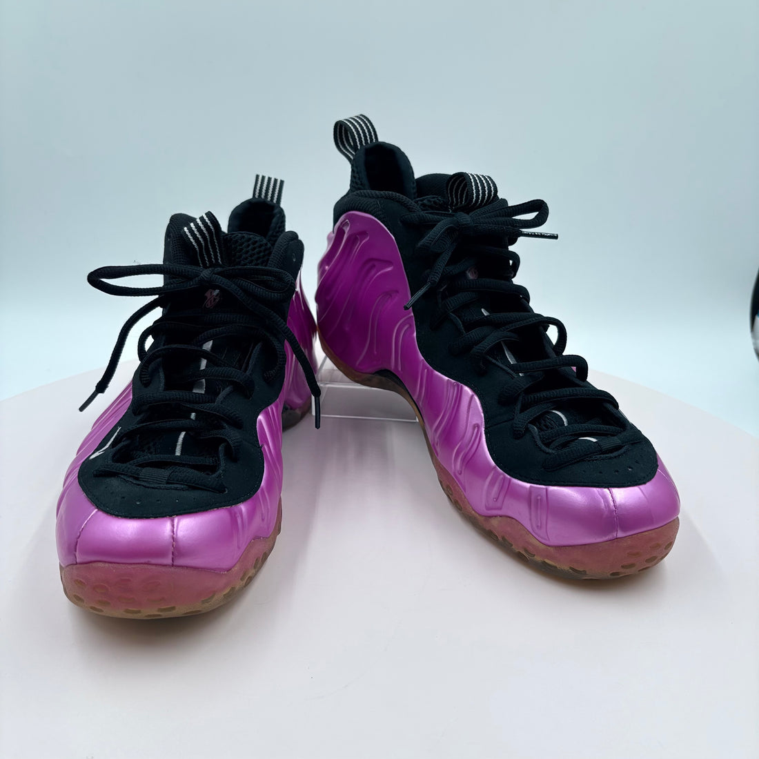 Purple and black sneakers on a white background