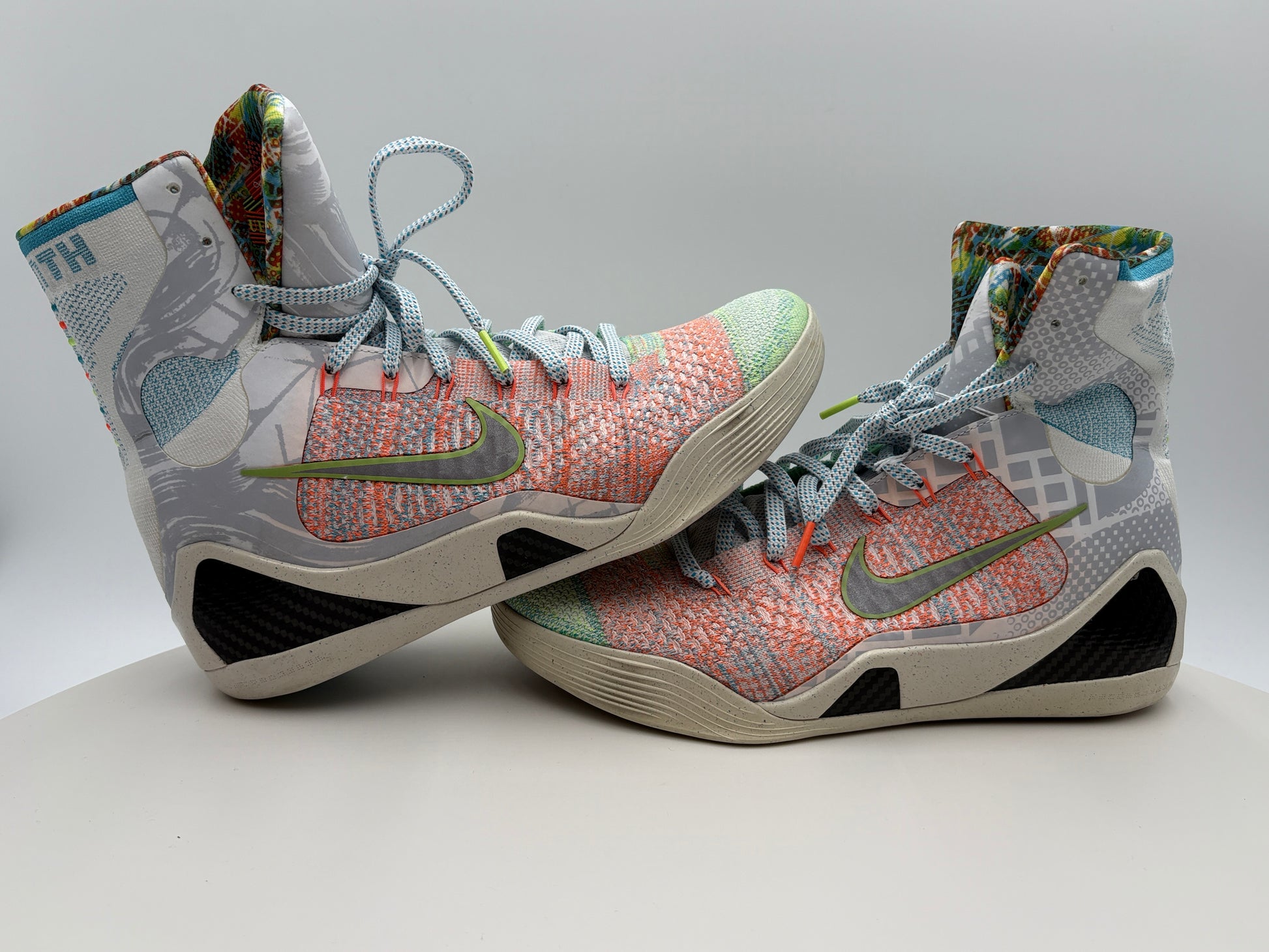 Colorful high-top sneakers with a patterned design on a light gray background