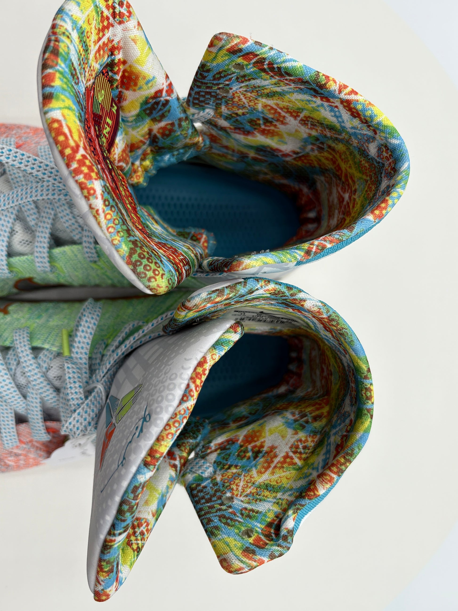 Colorful ceramic shoes with a textured finish on a white background