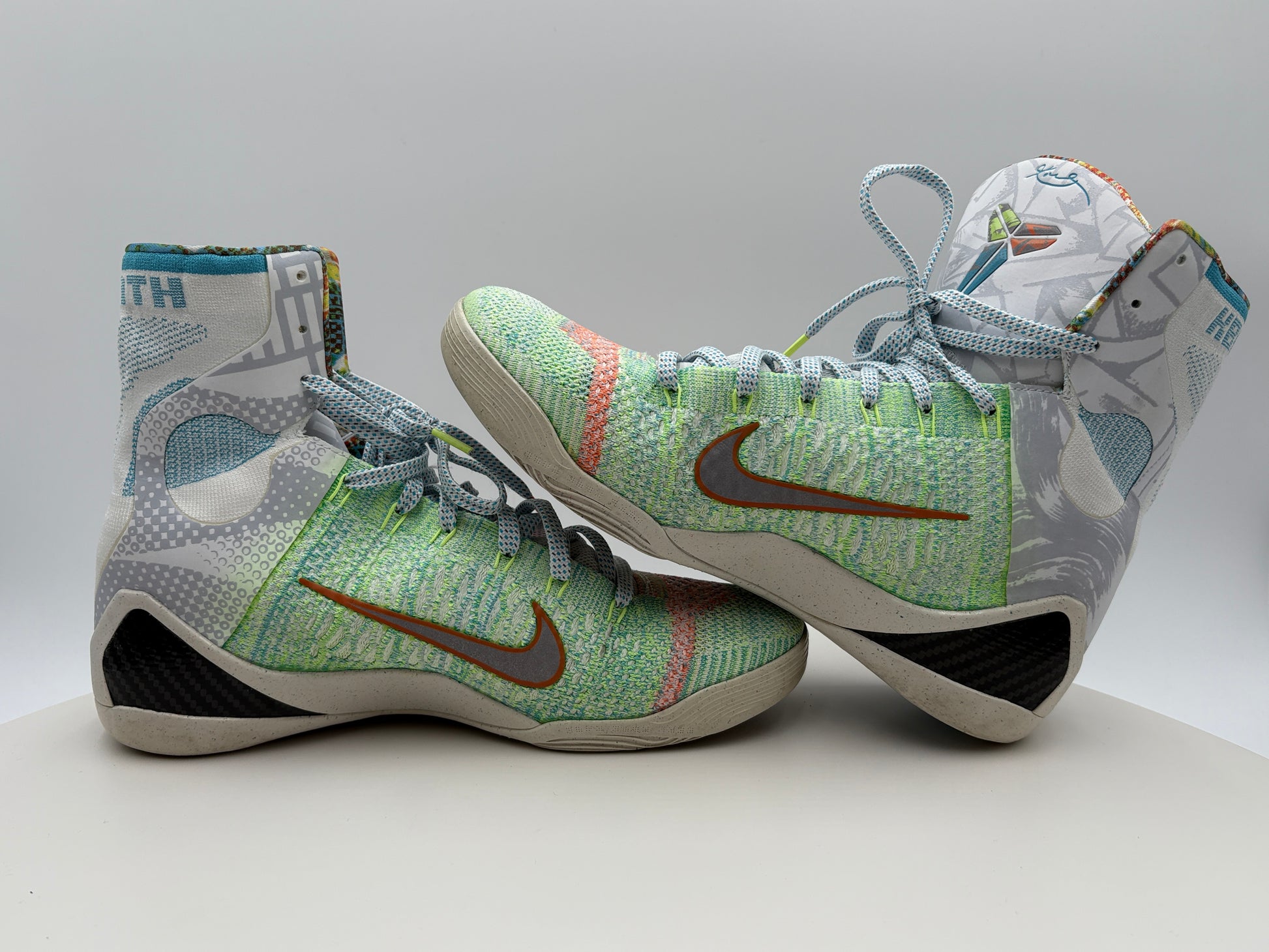 Pair of colorful sneakers with a Nike logo on a gray background