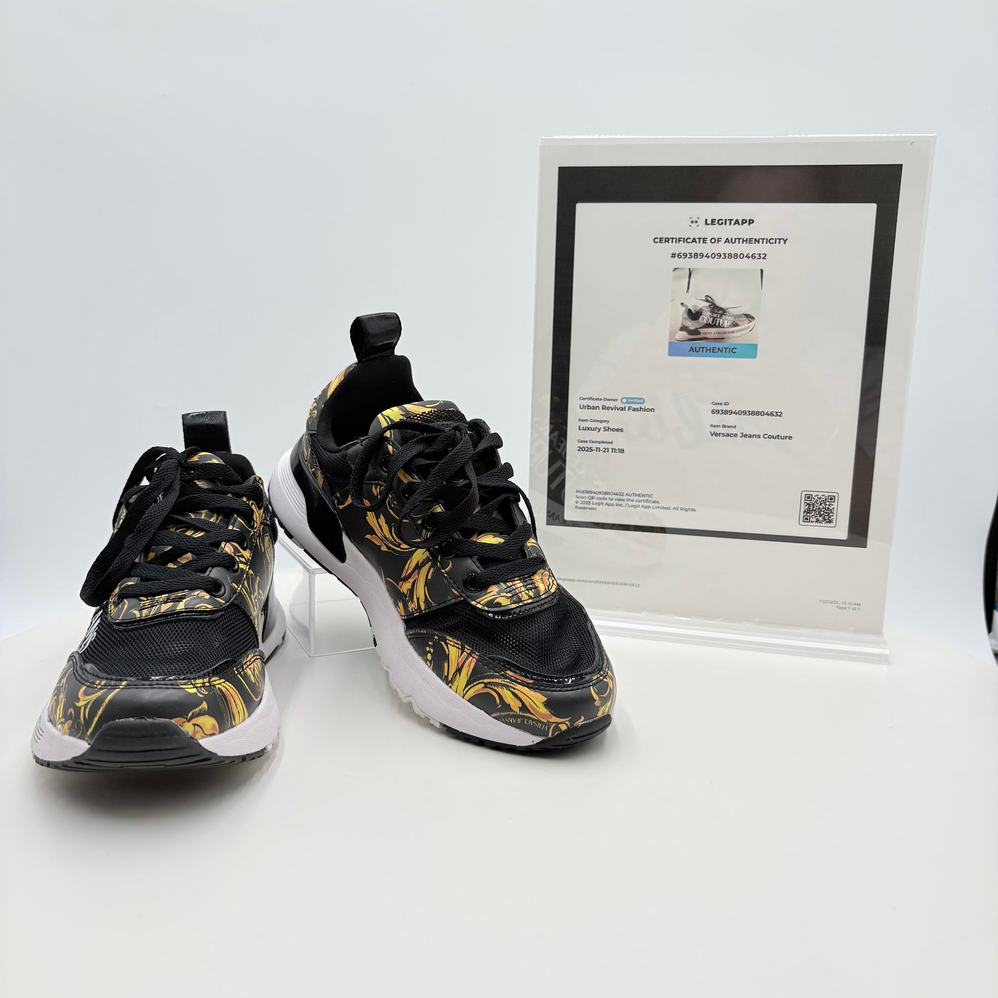 Black and yellow patterned sneakers with a certificate of authenticity on a white background