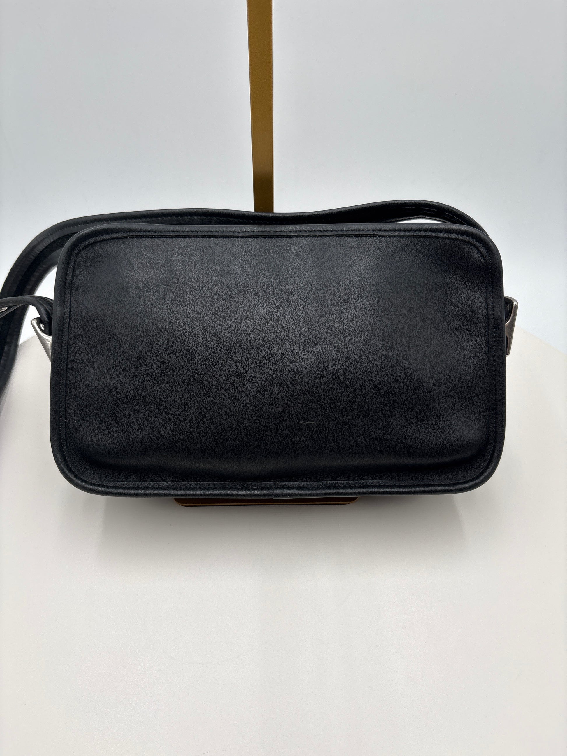 Black leather bag on a white background