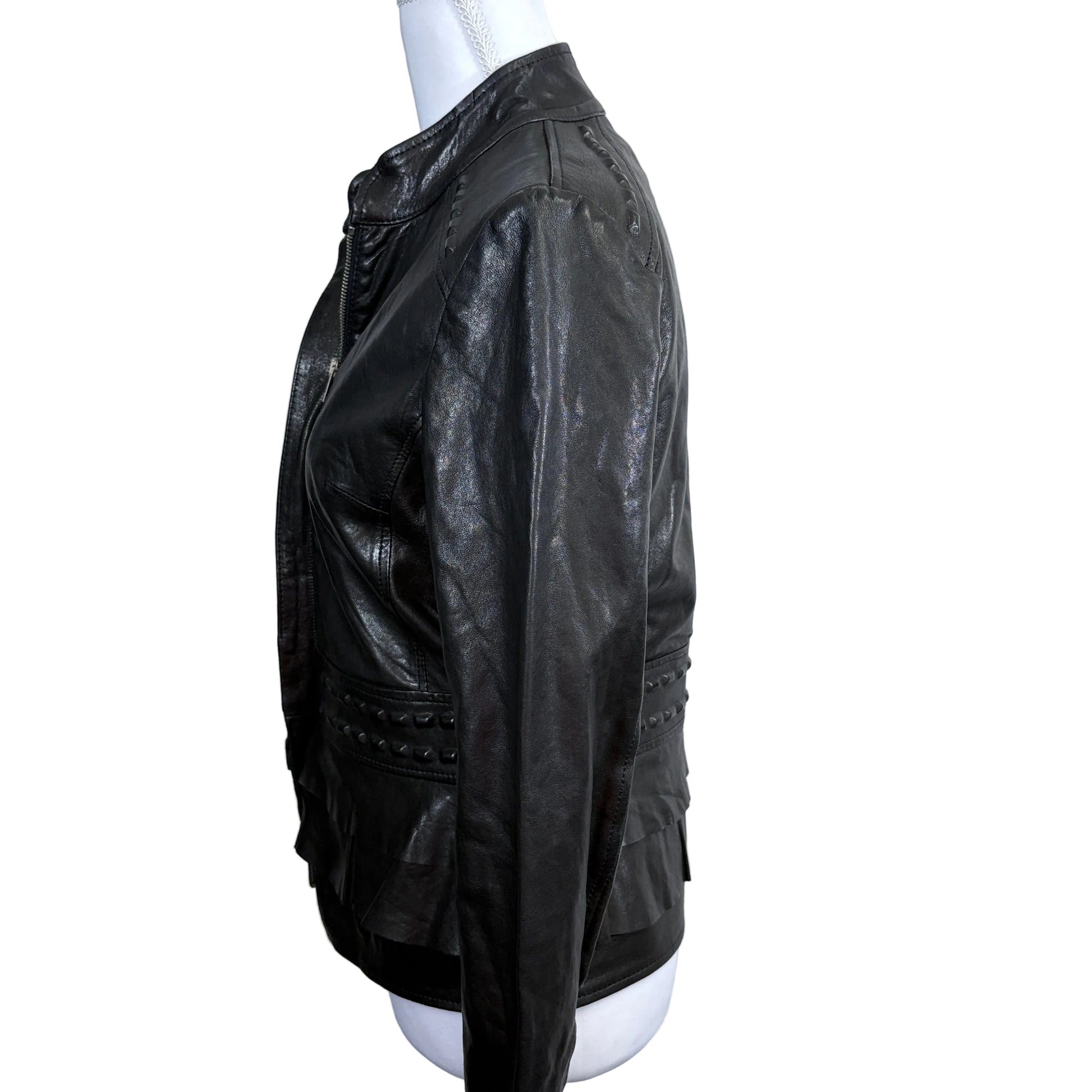 Black leather jacket on a mannequin against a white background - side