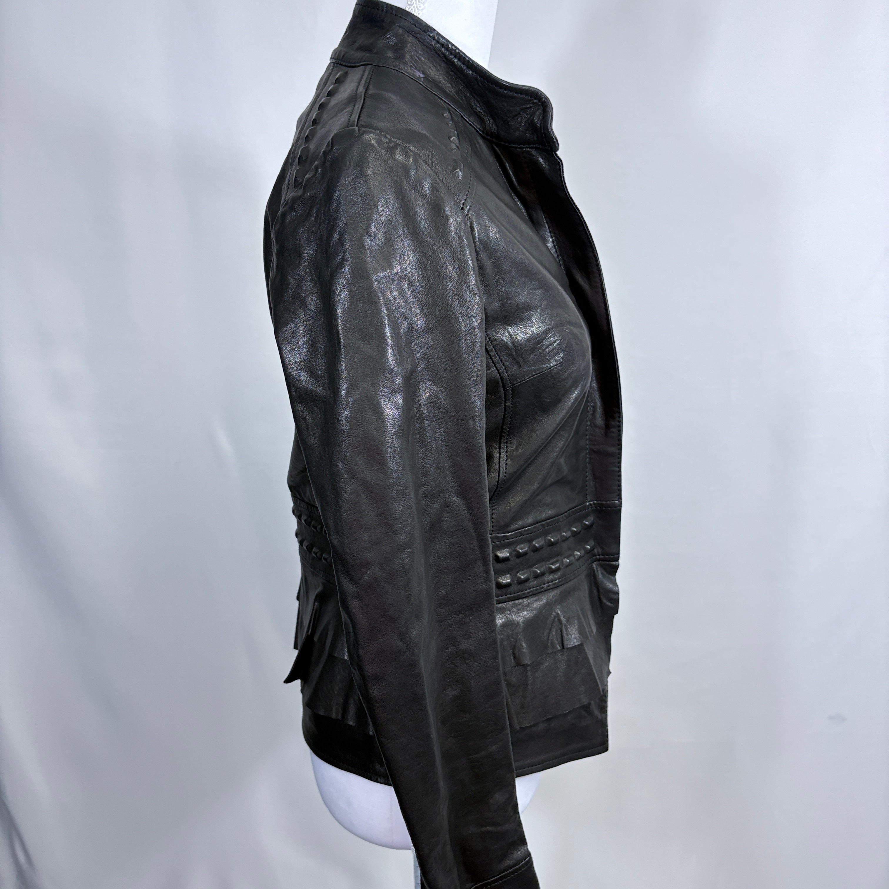 Black leather jacket on a mannequin against a white background - right side
