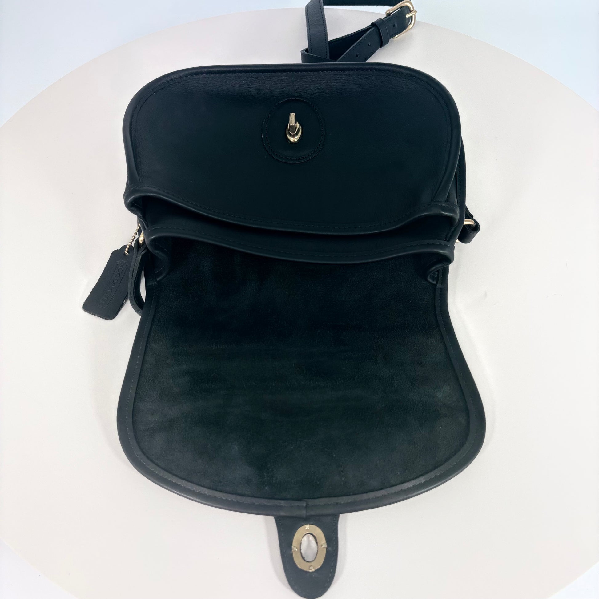 Black backpack on a white surface