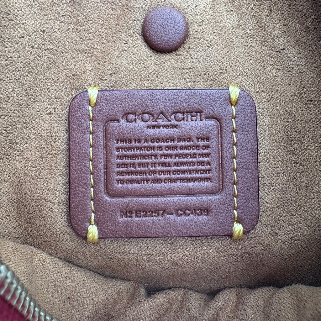Coach bag label on a brown leather bag