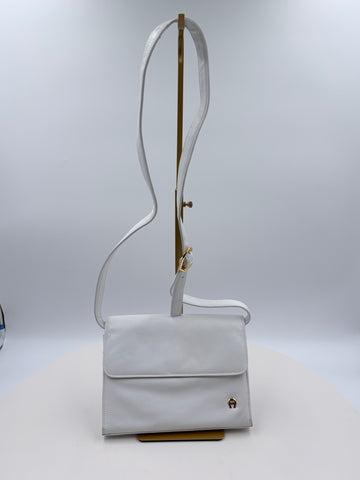 Ettienne white crossbody with wallet, makeup purse, detachable key ring and mirror. a lot of purse in a small package