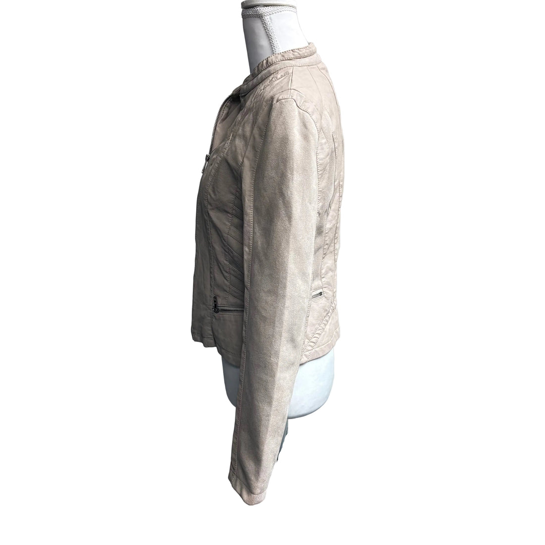Beige jacket on a mannequin against a white background