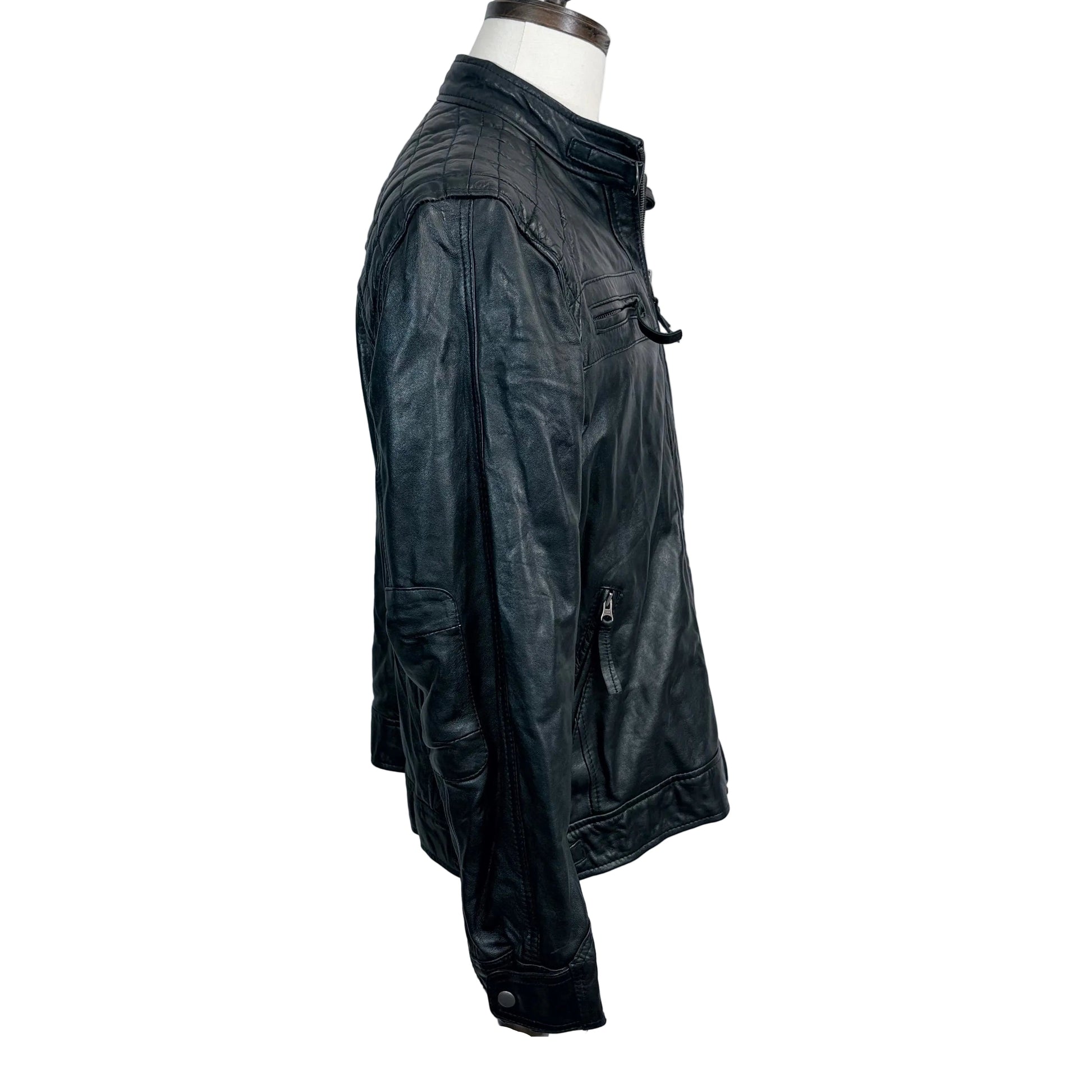 Black leather jacket on a mannequin against a white background