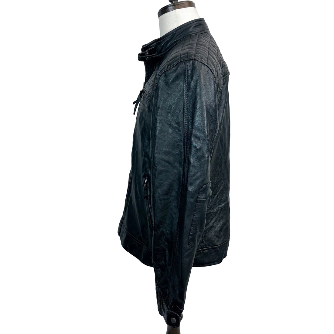 Black leather jacket on a mannequin against a white background
