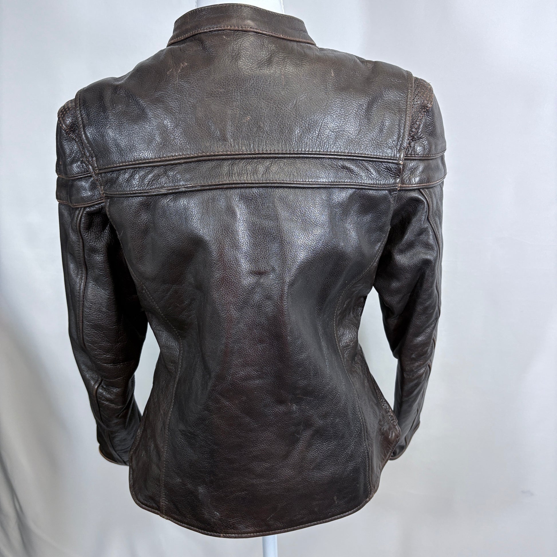Black leather jacket on a mannequin against a white background
