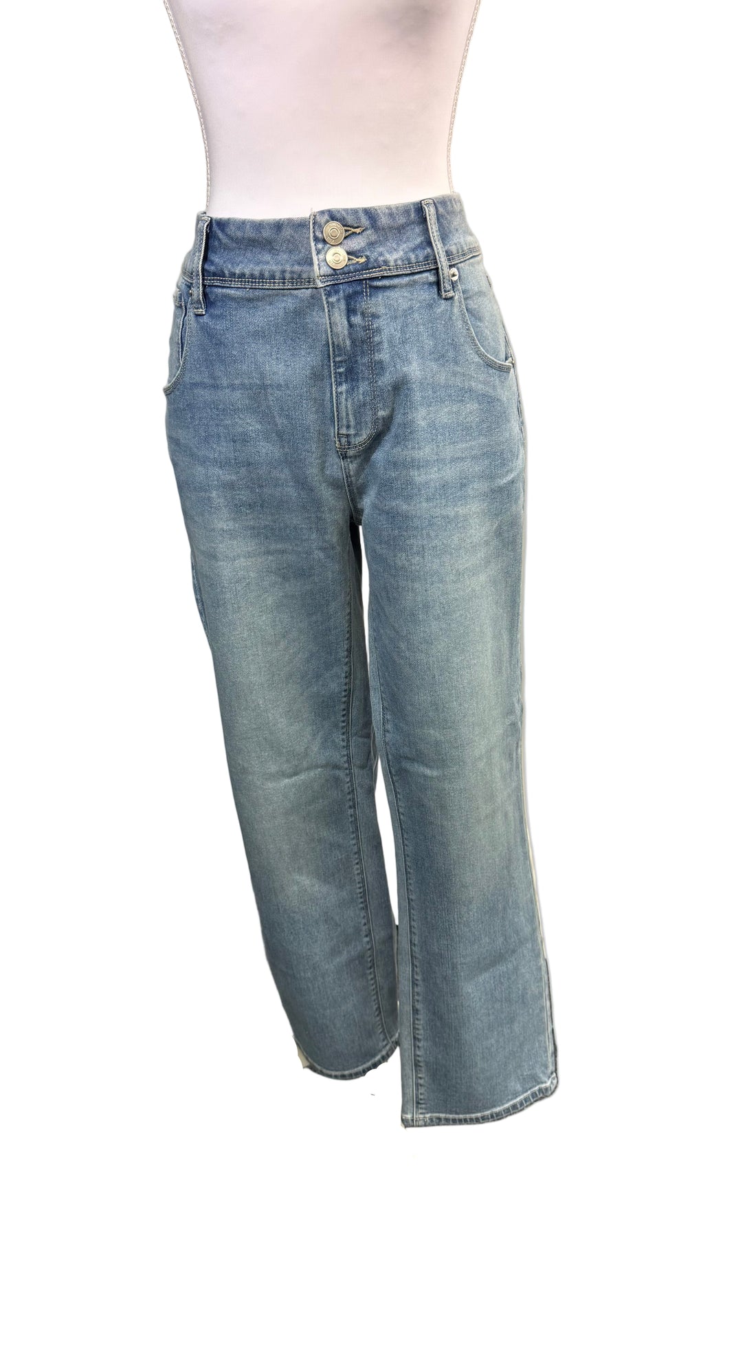 Light blue jeans on a mannequin against a plain background