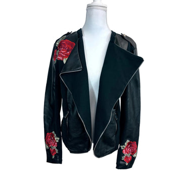 Black leather jacket with red rose embroidery on a mannequin against a white background
