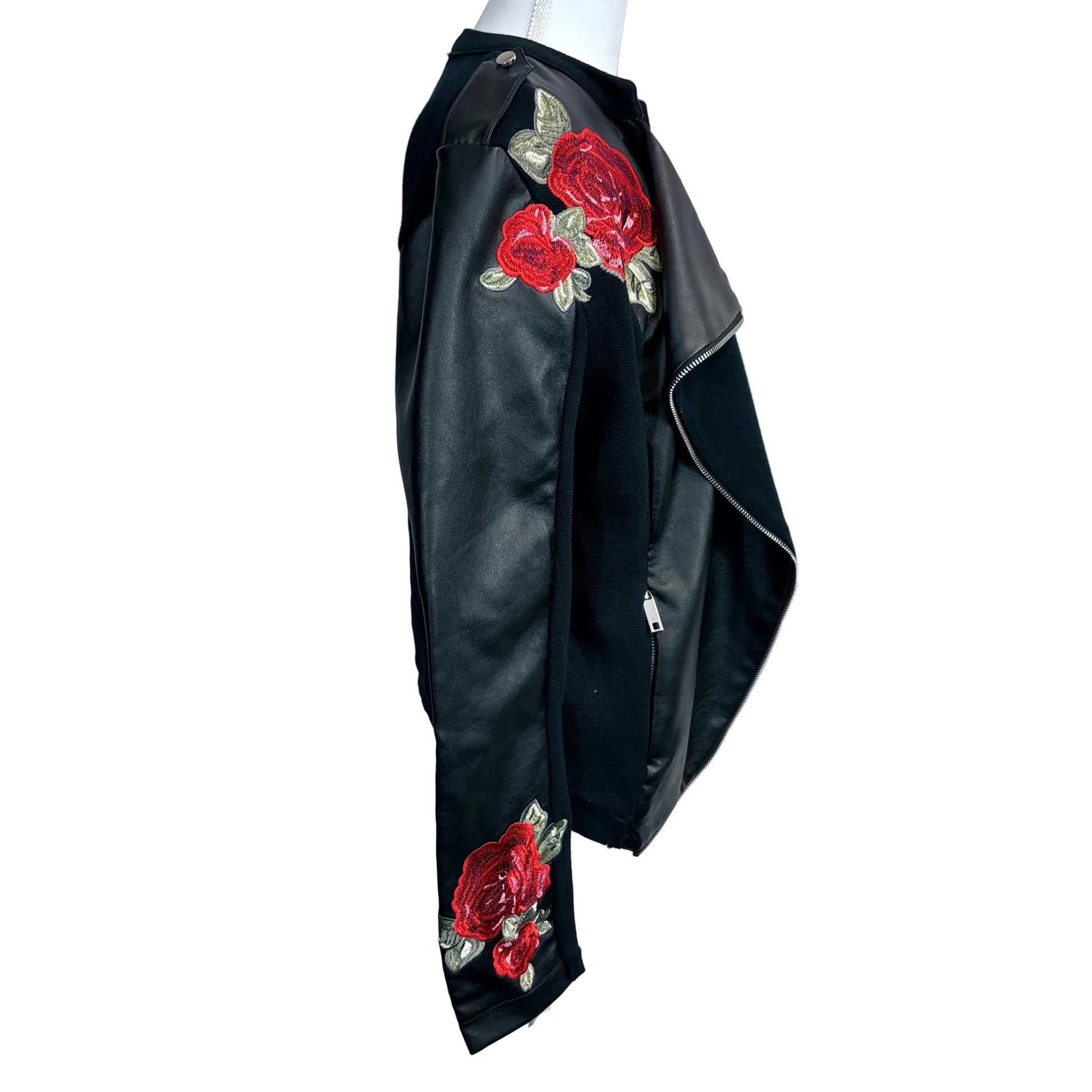 Black leather jacket with red rose embroidery on a mannequin against a white background