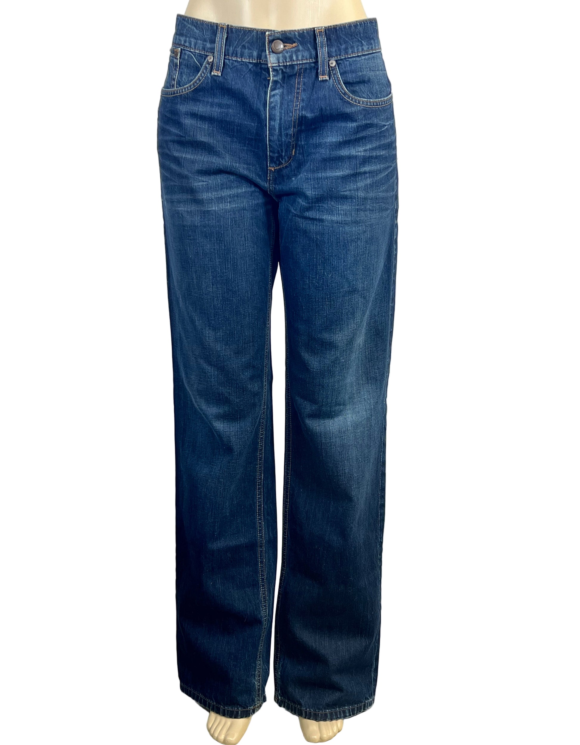 Blue jeans on a mannequin against a white background