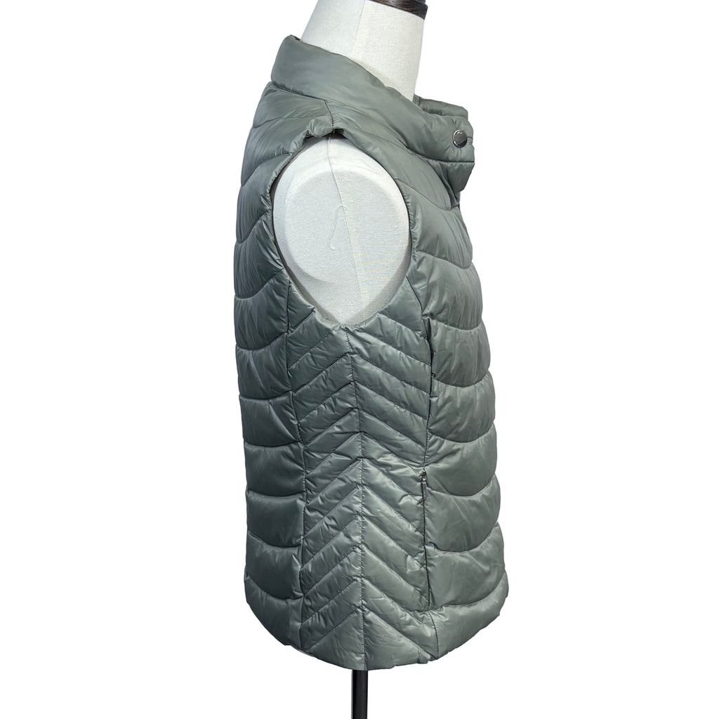 Gray quilted puffer vest on a mannequin against a plain background