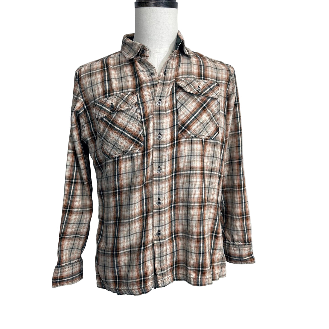 Plaid shirt on a mannequin against a white background