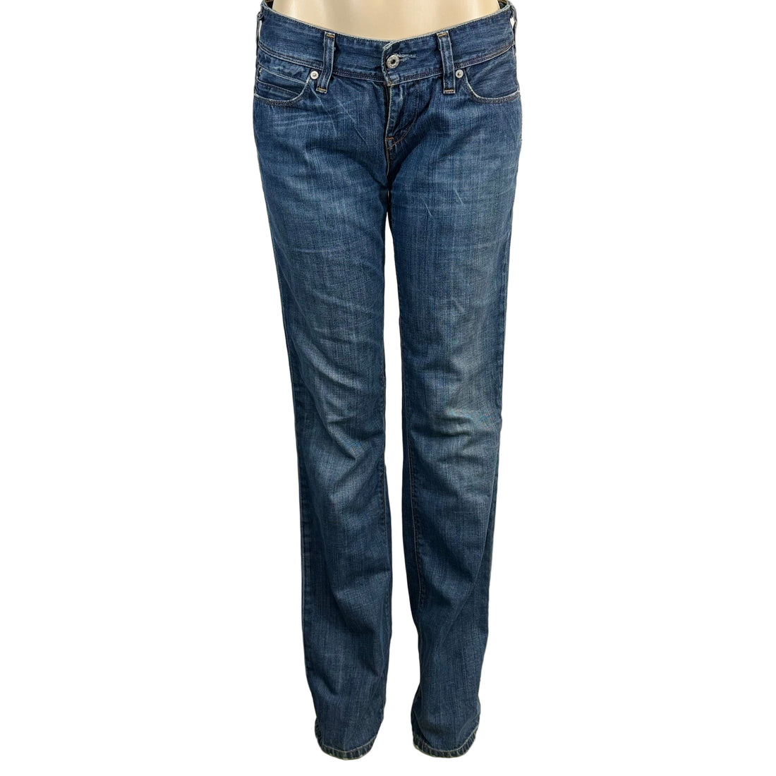 Blue jeans on a mannequin against a white background