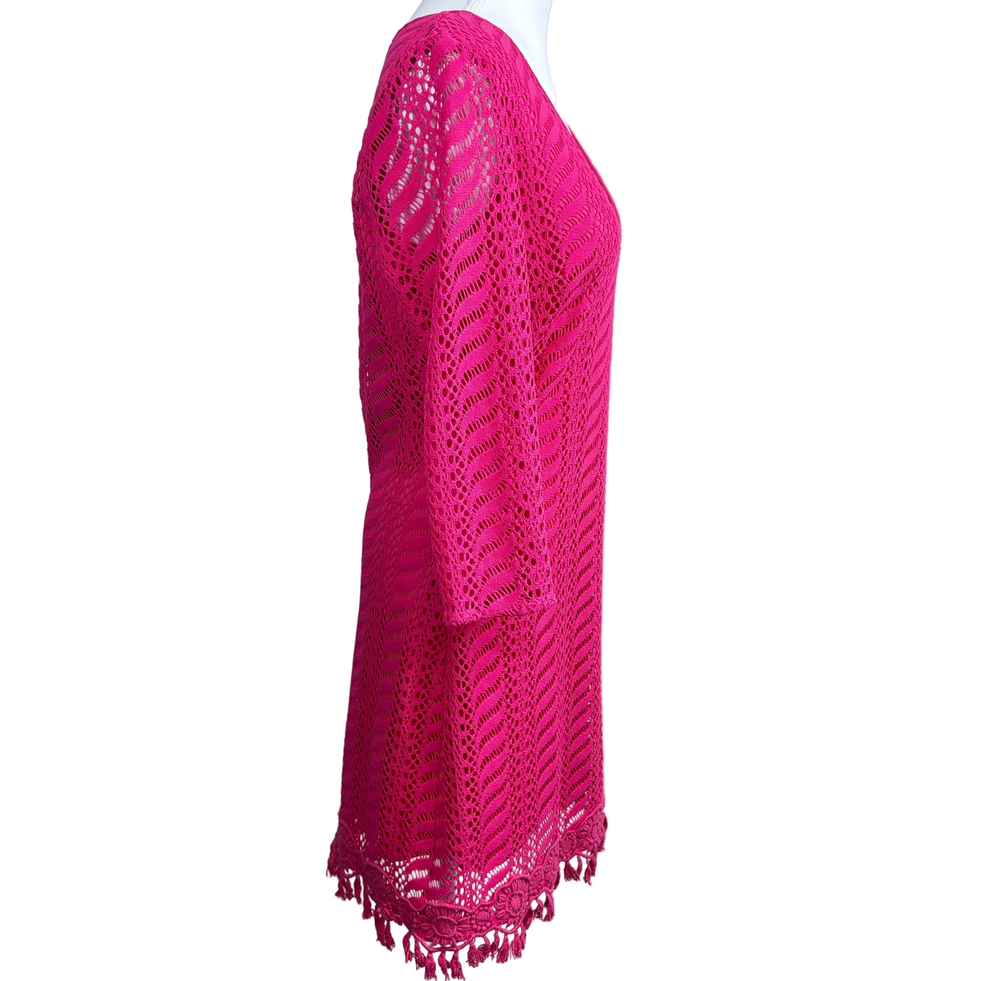 Pink knitted shawl on a white mannequin
