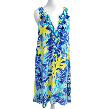 Blue and yellow floral dress on a mannequin against a white background
