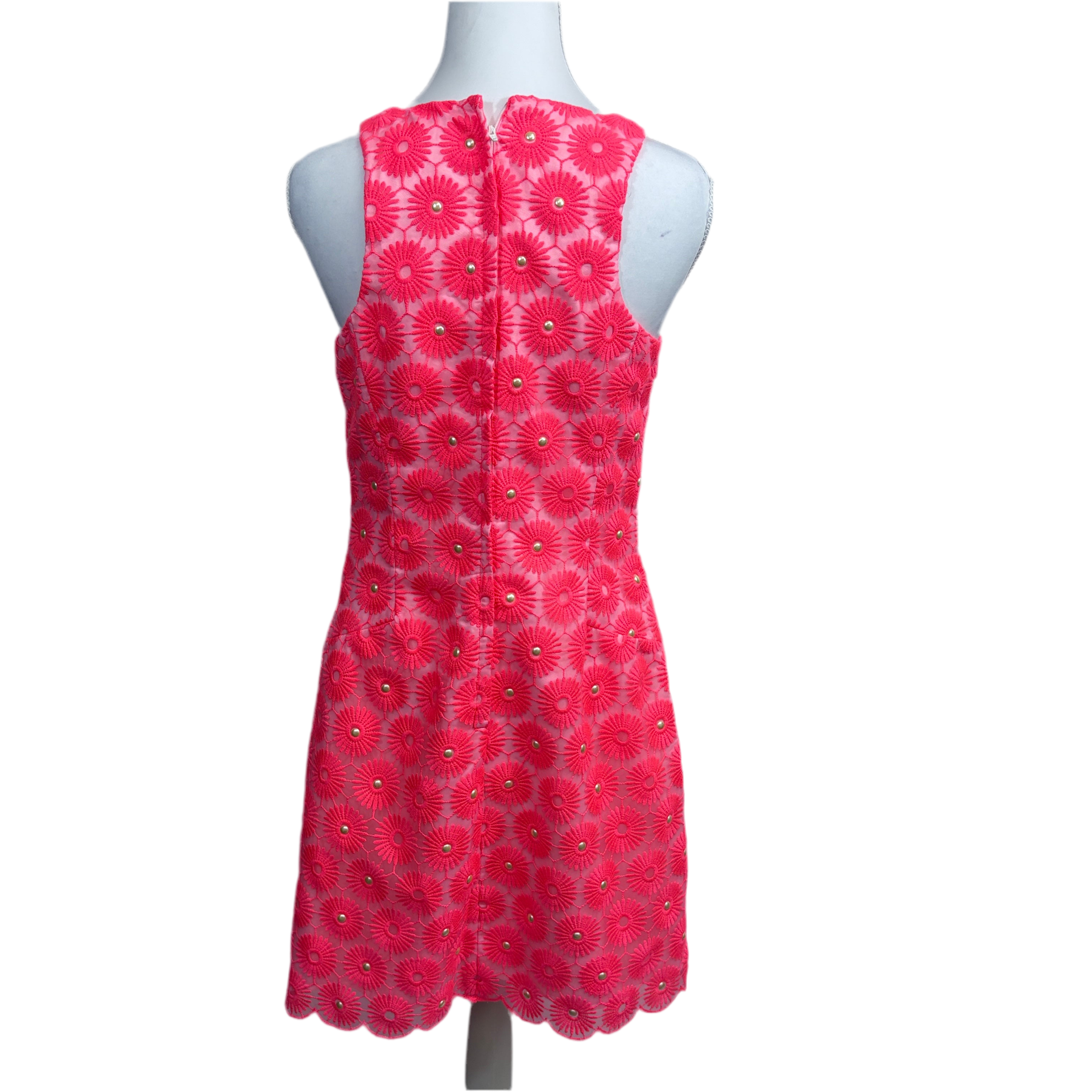 Back of floral dress on a mannequin against a white background