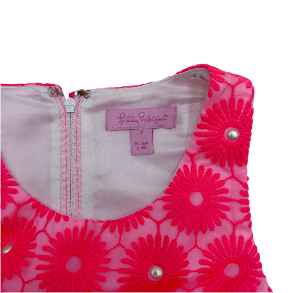 Pink floral dress with a visible size 2 label on a white background