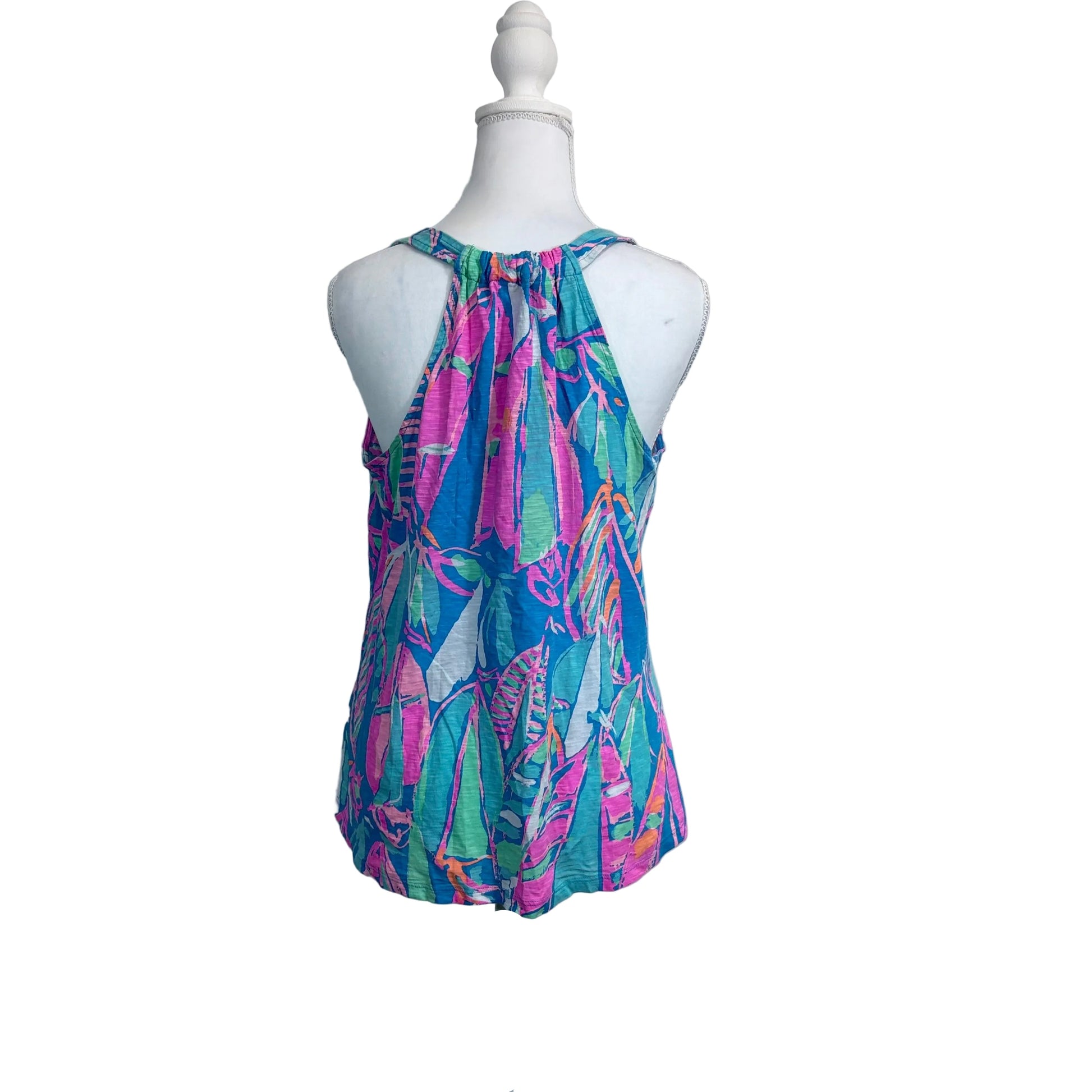 Colorful patterned top on a mannequin against a white background