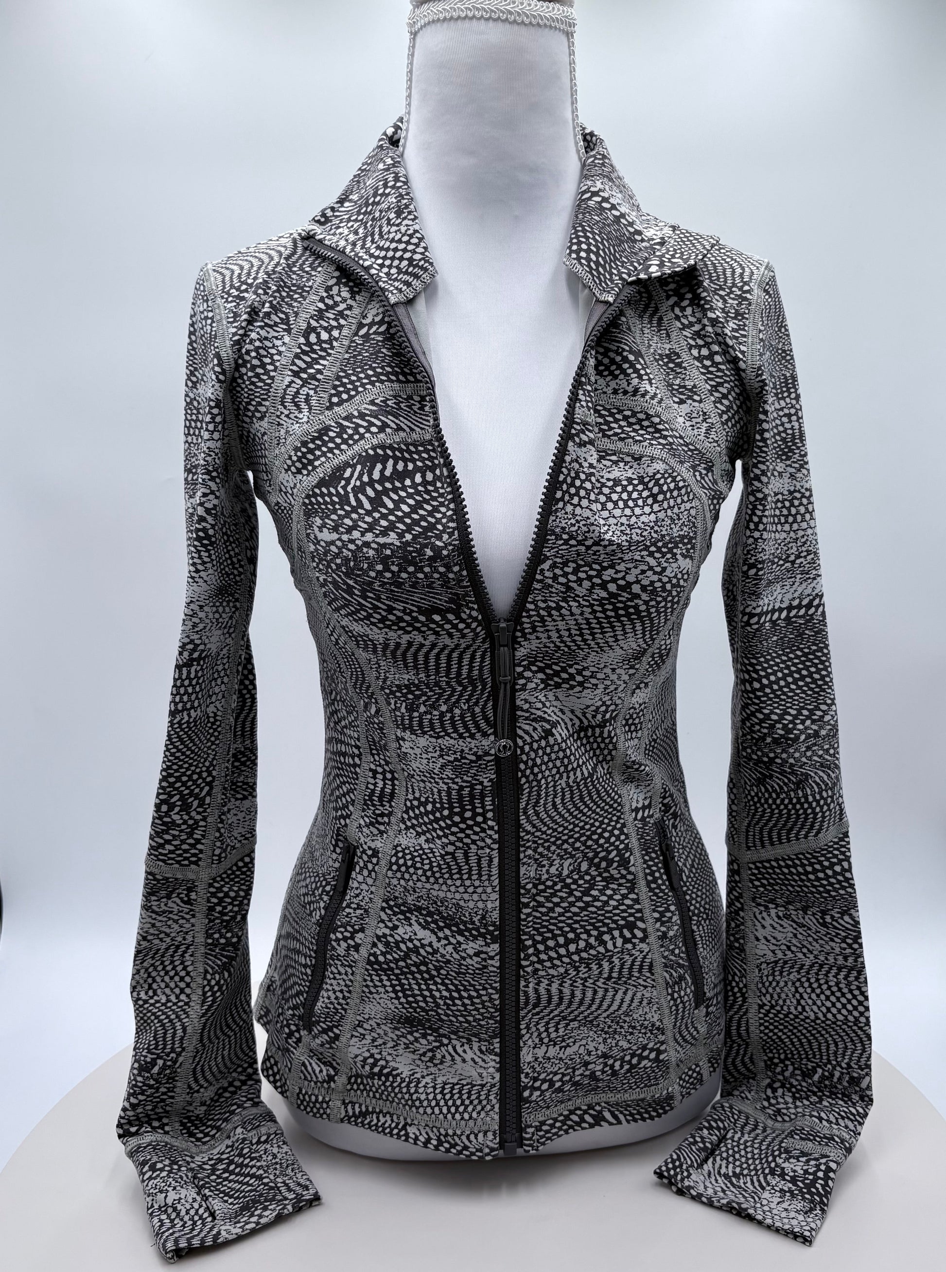 Patterned jacket on a mannequin against a white background