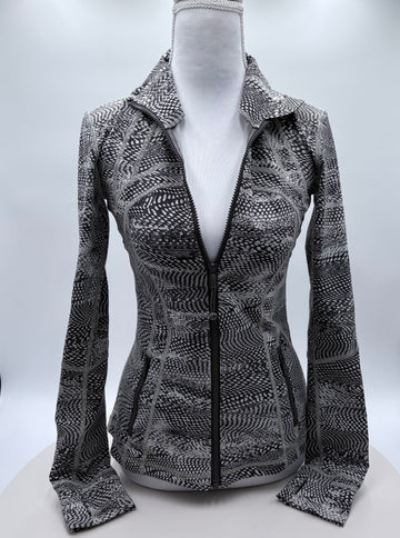 Patterned jacket on a mannequin against a white background