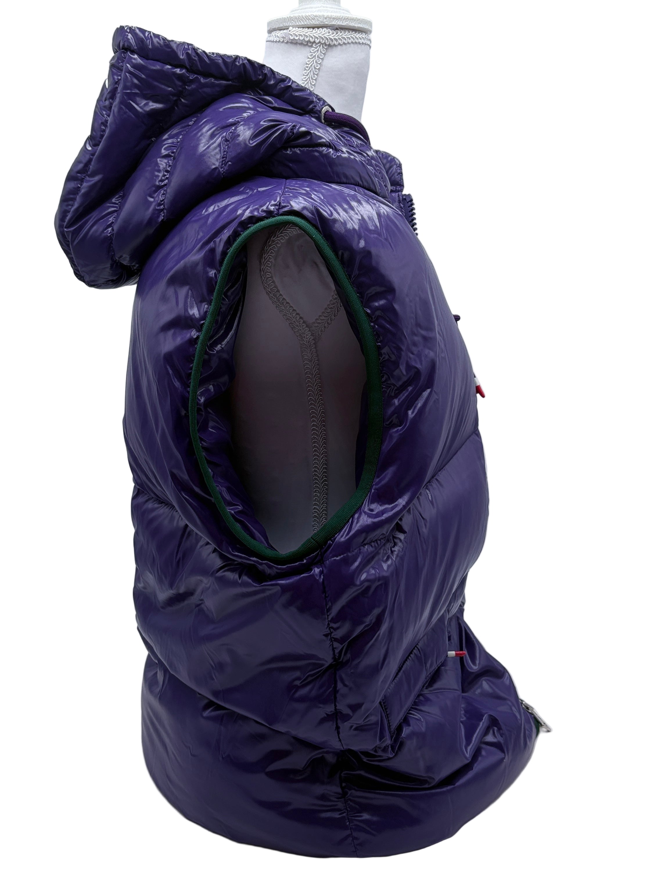 Purple puffer jacket on a mannequin against a white background