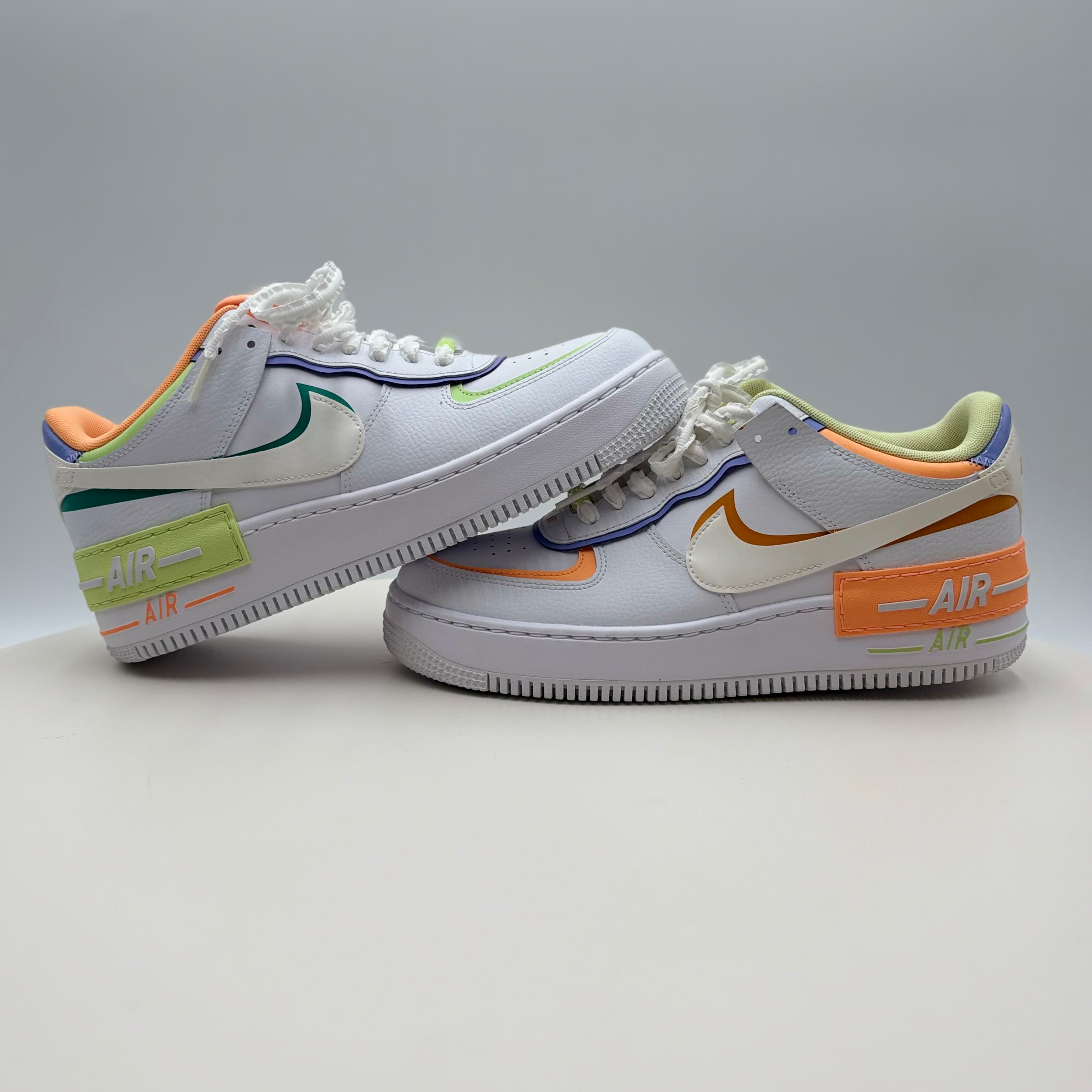 White sneakers with colorful accents on a gray background