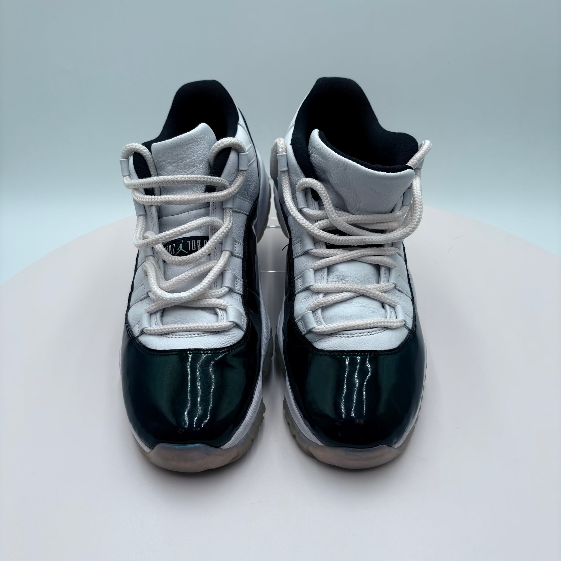 Pair of black and white sneakers on a light gray background