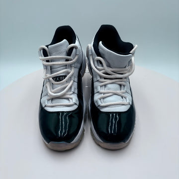 Pair of black and white sneakers on a light gray background