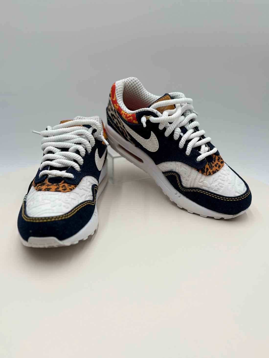 Pair of sneakers with a certificate of authenticity on a white background