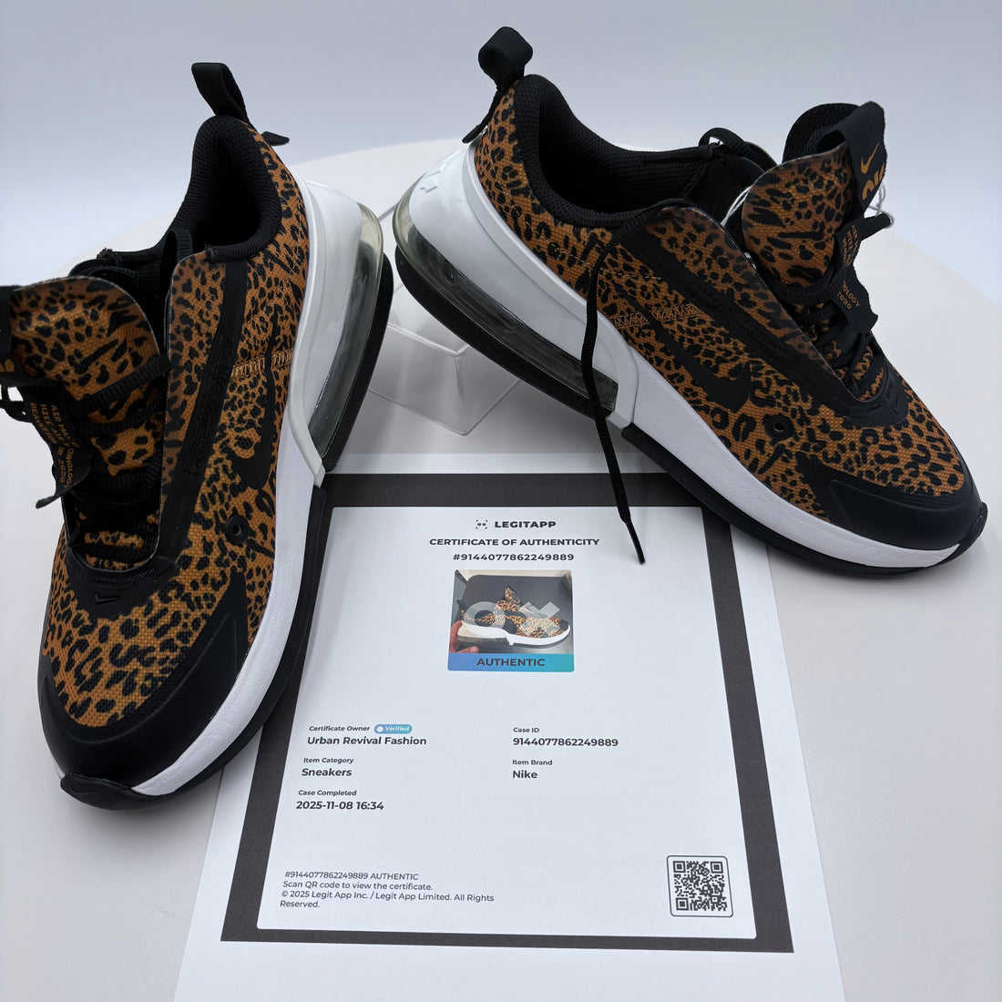Leopard print sneakers with a certificate of authenticity on a white background