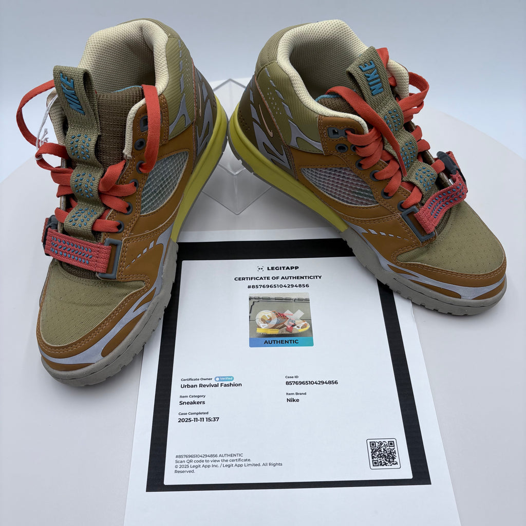 Pair of Nike sneakers with a certificate of authenticity on a white background