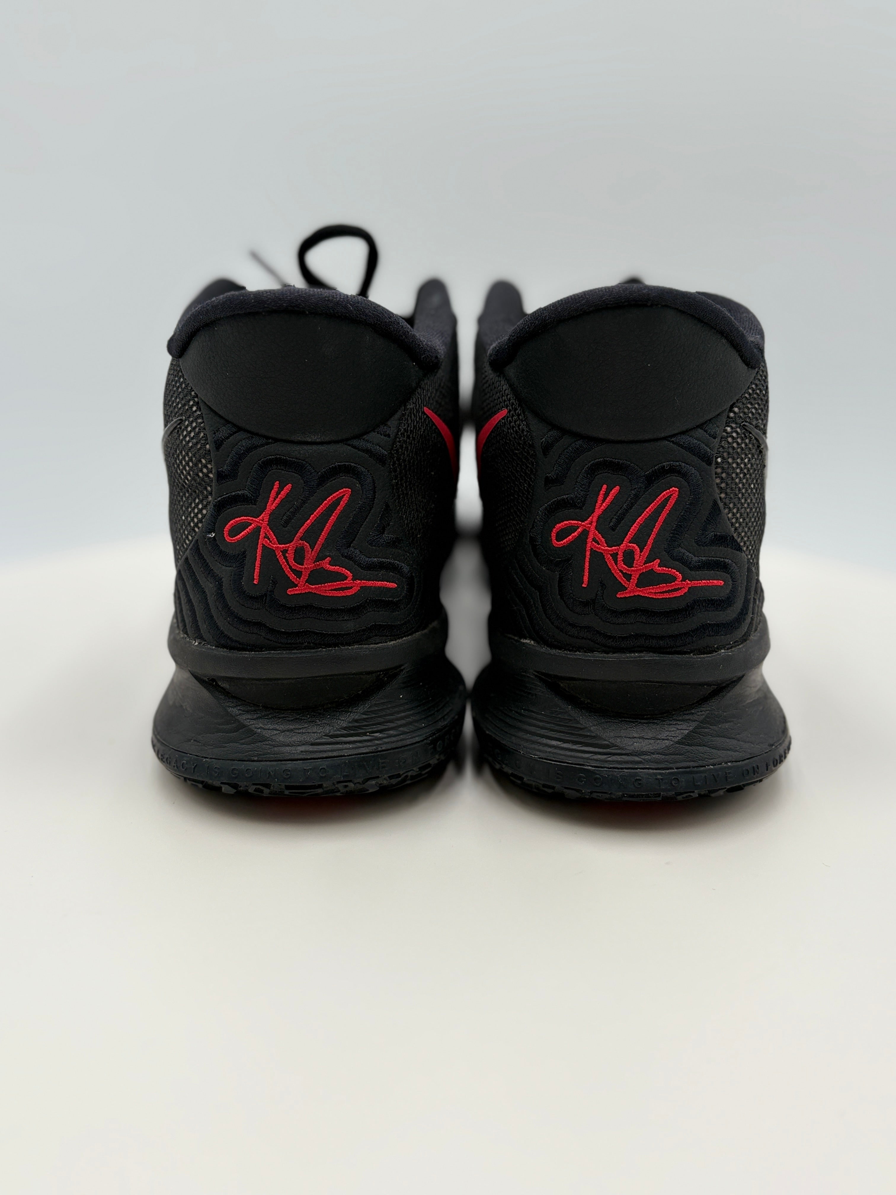  Back of Black sneakers with red logo on a white background