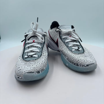 Pair of speckled sneakers on a light gray background
