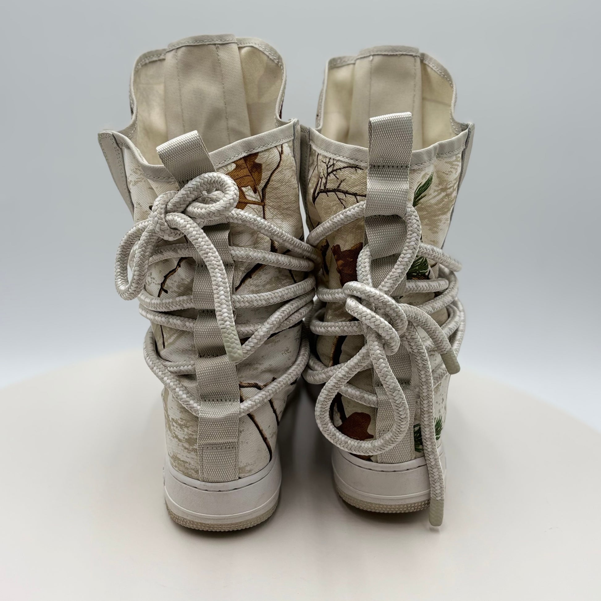 Pair of high-top sneakers with unique design on a white background