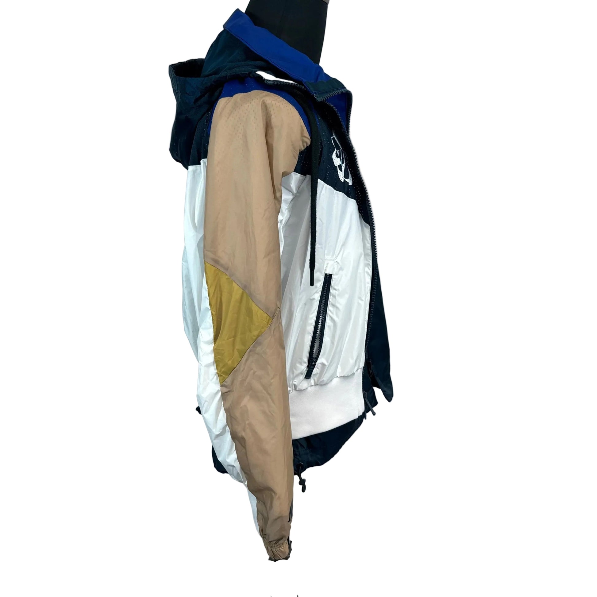 Multicolored jacket on a mannequin against a plain background